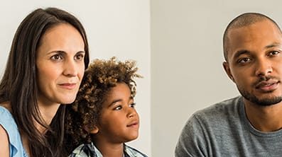 Mother, father and child in assessment room