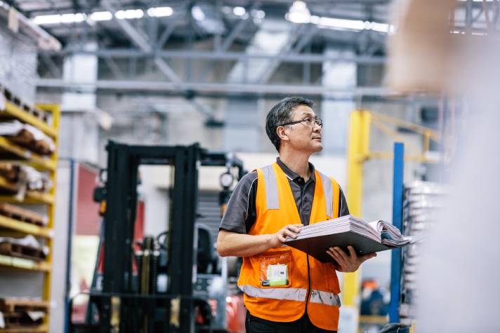 Man checking stock in factory