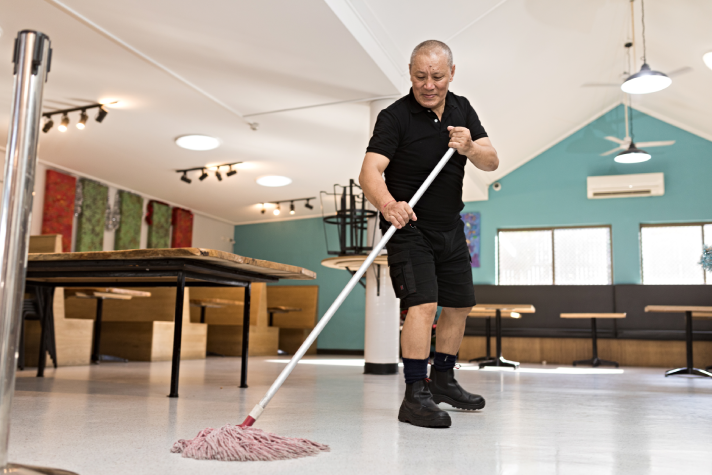 Tashi Dhondup cleaning at work