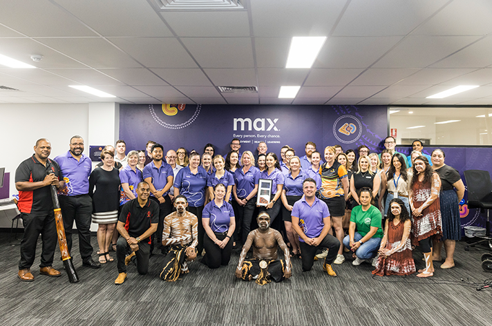 Group photo - New MAX office opens in Cairns with moving Welcome to Country 