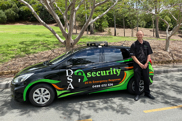 Raymond standing in front of his work vehicle