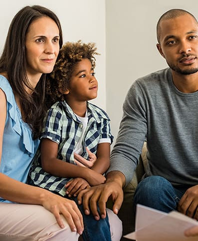 mother, father and child in assessment room