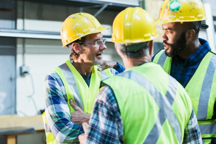 three-multiethnic-workers-with-safety-vests-and-hard-hats-picture-workplace conflict article