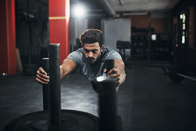 Person trying hard to move weights