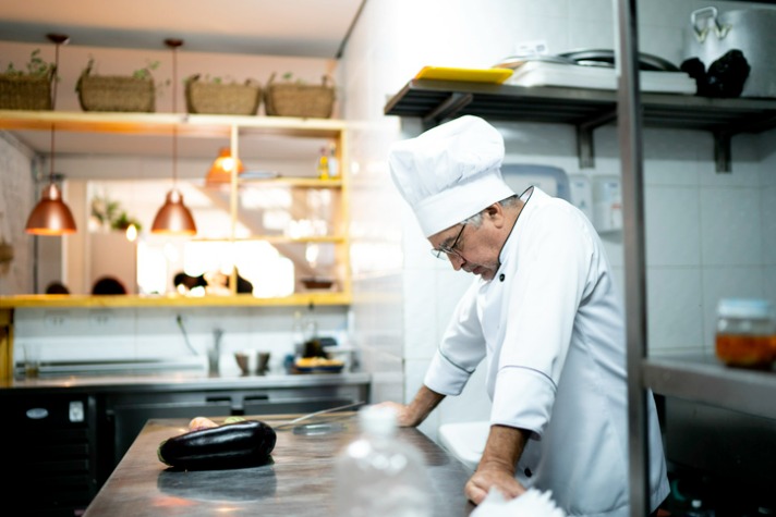 A male chef stressed at work - dealing with stress in the workplace article