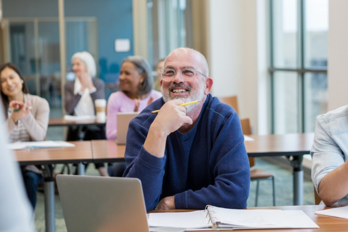 short course article image - older man happy in classroom