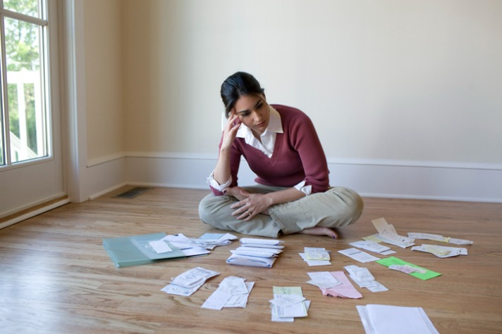 woman looking at pile of bills No Interest loans